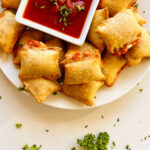 air fryer frozen pizza rolls on plate with marinara sauce