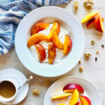 air fryer nectarines in a bowl with yogurt and granola with coffee