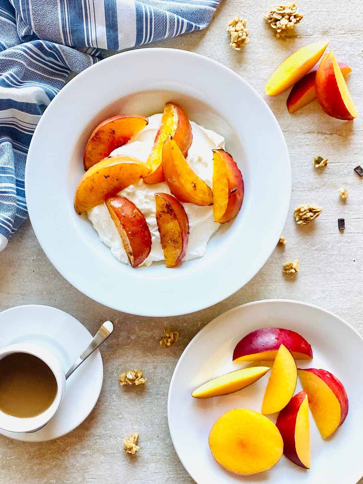 air fryer nectarines in a bowl with yogurt and granola with coffee