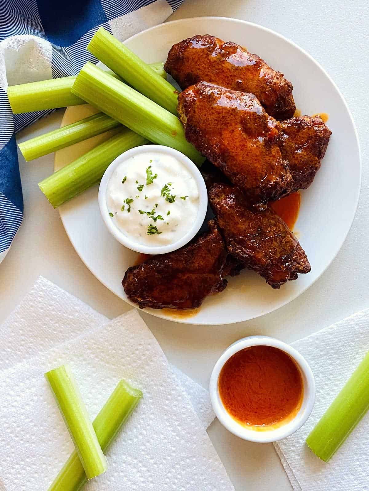 buffalo chicken wings on plate with blue cheese and celery