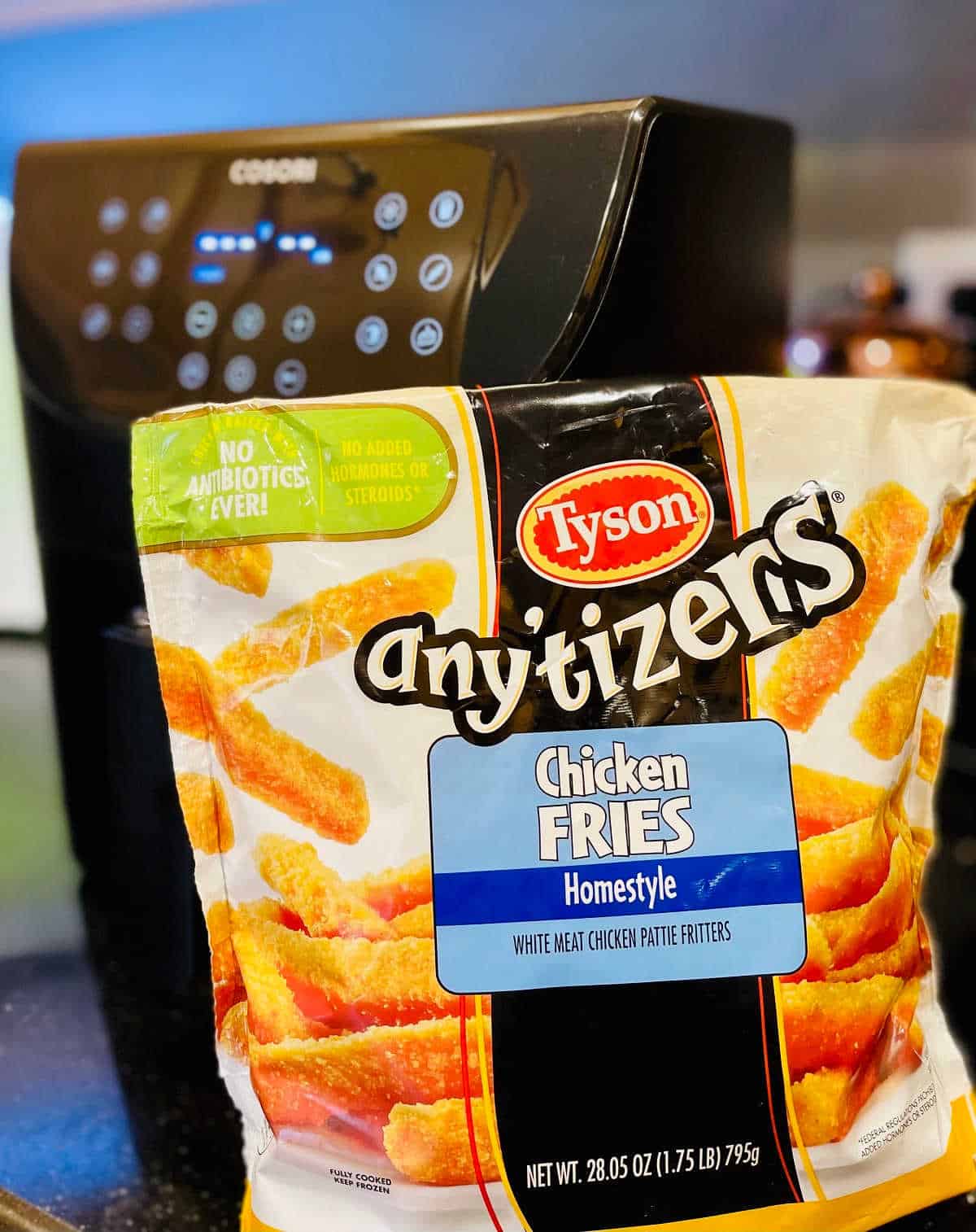 bag of tyson any'tizers chicken fries with cosori air fryer in the background